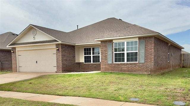 ranch-style house with driveway, a shingled roof, a front yard, an attached garage, and brick siding