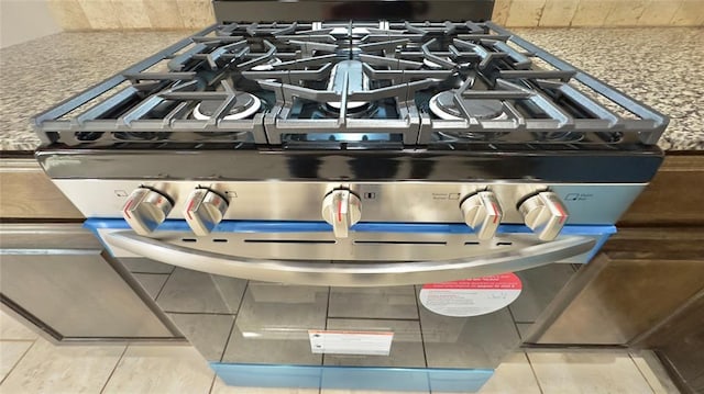 room details with stainless steel gas stove