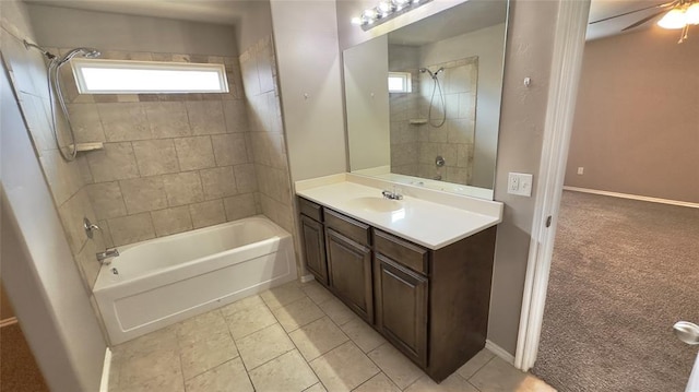 full bath with vanity, plenty of natural light,  shower combination, and baseboards