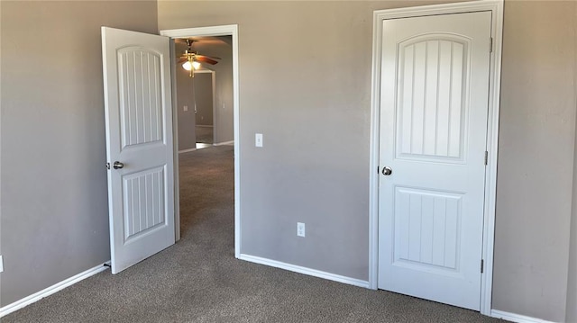 unfurnished bedroom with carpet floors and baseboards