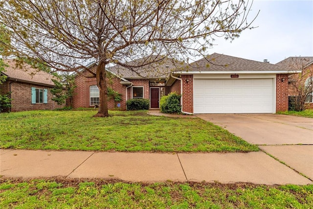 17413 Platinum Ln, Edmond, OK 73012 - ranch-style home featuring brick siding, an attached garage, driveway, and a front yard