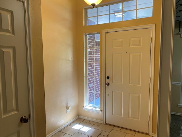 17413 Platinum Ln, Edmond, OK 73012 - foyer entrance featuring baseboards and light tile patterned flooring
