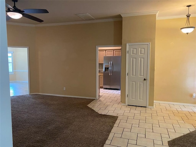 17413 Platinum Ln, Edmond, OK 73012 - unfurnished room with ceiling fan, baseboards, crown molding, and light tile patterned flooring