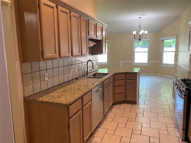 17413 Platinum Ln, Edmond, OK 73012 - kitchen featuring a sink, stainless steel appliances, backsplash, a peninsula, and stone counters
