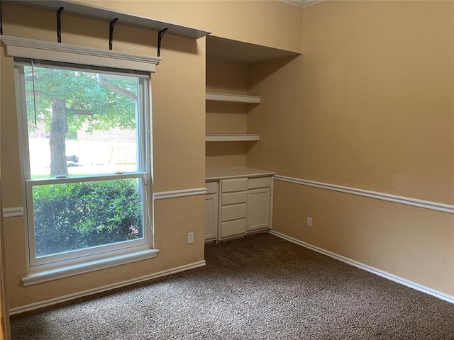 17413 Platinum Ln, Edmond, OK 73012 - empty room featuring dark colored carpet and baseboards
