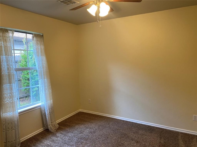 17413 Platinum Ln, Edmond, OK 73012 - unfurnished room with ceiling fan, plenty of natural light, dark carpet, and baseboards