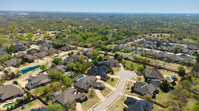 birds eye view of property with a residential view