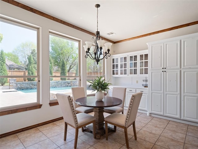 dining space featuring light tile patterned flooring, crown molding, an inviting chandelier, and visible vents