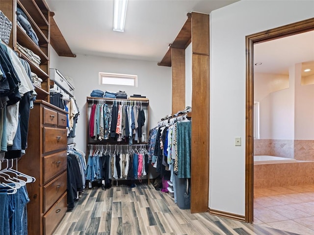 walk in closet featuring wood finished floors