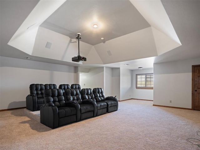 home theater featuring carpet flooring, visible vents, baseboards, and lofted ceiling