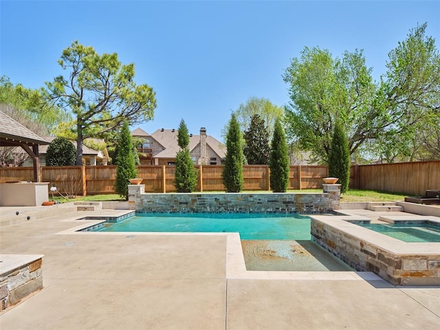 view of swimming pool featuring a fenced backyard, an in ground hot tub, a fenced in pool, and a patio