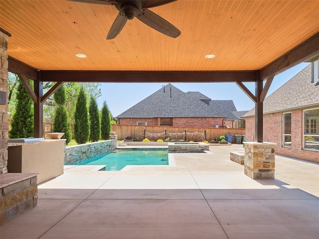 view of swimming pool featuring a ceiling fan, fence, a patio, an in ground hot tub, and a fenced in pool