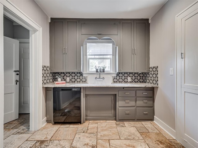 1016 E Edwards St, Edmond, OK 73034 - kitchen with gray cabinetry, backsplash, black dishwasher, and stone tile flooring