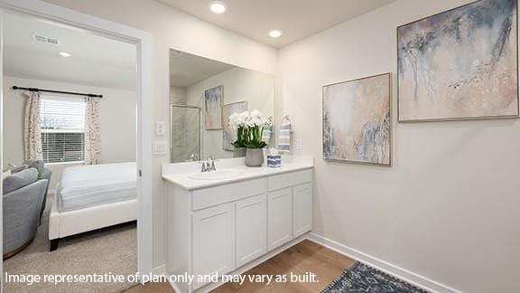 5510 Windstone Ln, Norman, OK 73072 - bathroom with baseboards, vanity, recessed lighting, an enclosed shower, and wood finished floors