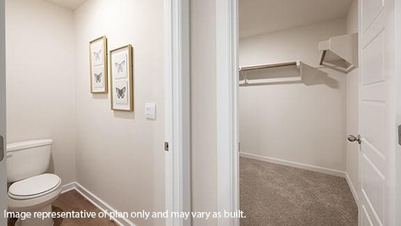 5510 Windstone Ln, Norman, OK 73072 - bathroom featuring baseboards and toilet