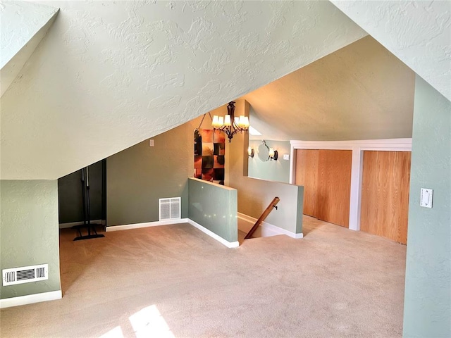 1909 N Gatewood Ave, Oklahoma City, OK 73106 - additional living space with visible vents, carpet, and a textured ceiling