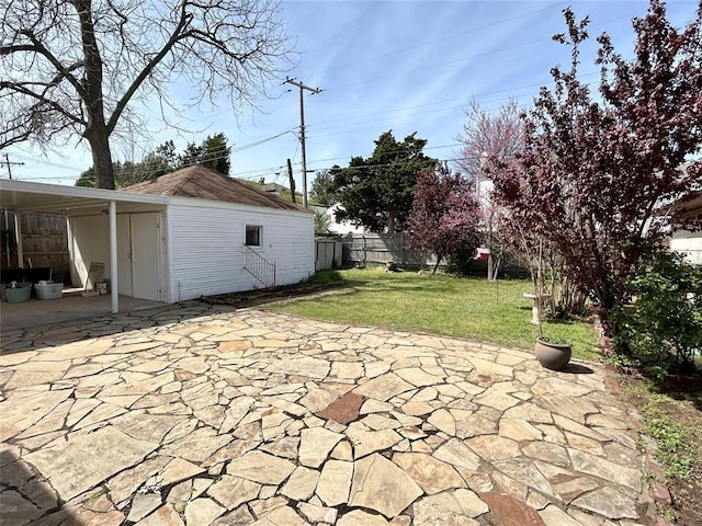 1909 N Gatewood Ave, Oklahoma City, OK 73106 - view of patio / terrace featuring a carport and fence