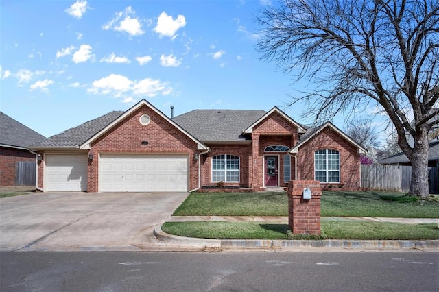 4113 Annalane Dr, Norman, OK 73072 - ranch-style home with fence, a garage, concrete driveway, a front yard, and brick siding