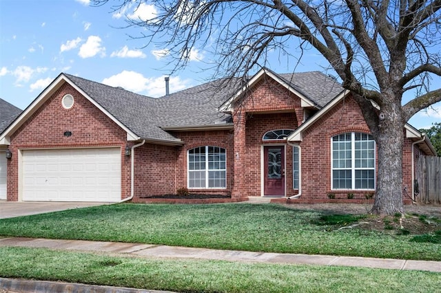 4113 Annalane Dr, Norman, OK 73072 - view of front of property with brick siding, a garage, roof with shingles, and a front lawn