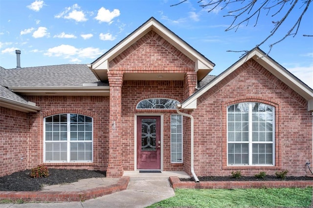 4113 Annalane Dr, Norman, OK 73072 - view of exterior entry featuring brick siding and roof with shingles