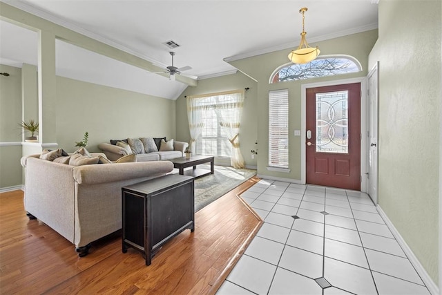4113 Annalane Dr, Norman, OK 73072 - foyer with light wood-type flooring, ornamental molding, baseboards, ceiling fan, and visible vents