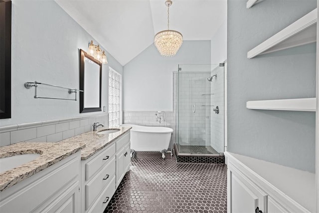 4113 Annalane Dr, Norman, OK 73072 - full bath with a sink, a shower stall, a freestanding bath, double vanity, and an inviting chandelier