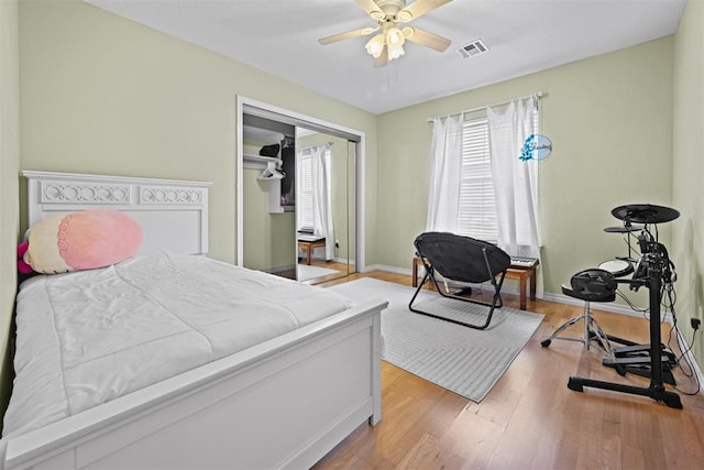 4113 Annalane Dr, Norman, OK 73072 - bedroom featuring baseboards, visible vents, ceiling fan, and wood finished floors