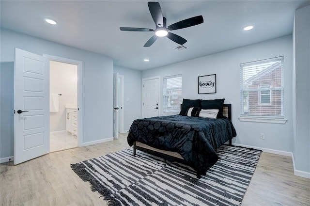 bedroom featuring ensuite bathroom, visible vents, baseboards, recessed lighting, and light wood-style floors