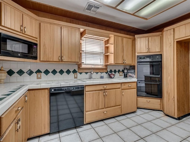 27704 S County Line Ave, Blanchard, OK 73010 - kitchen featuring light brown cabinets, black appliances, decorative backsplash, and visible vents