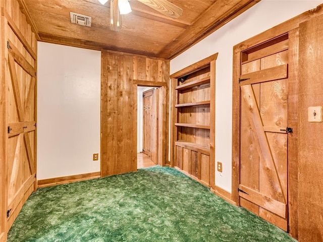 27704 S County Line Ave, Blanchard, OK 73010 - carpeted bedroom with wooden ceiling, baseboards, wooden walls, and visible vents