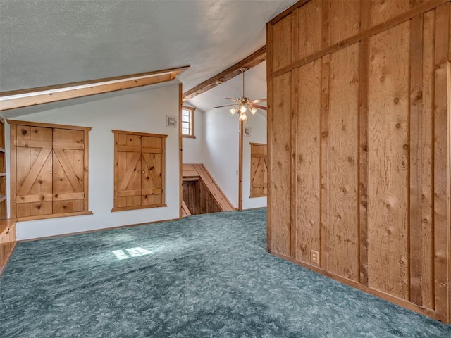 27704 S County Line Ave, Blanchard, OK 73010 - additional living space featuring wooden walls, carpet floors, ceiling fan, and lofted ceiling with beams