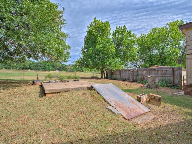 27704 S County Line Ave, Blanchard, OK 73010 - view of storm shelter with a lawn and fence