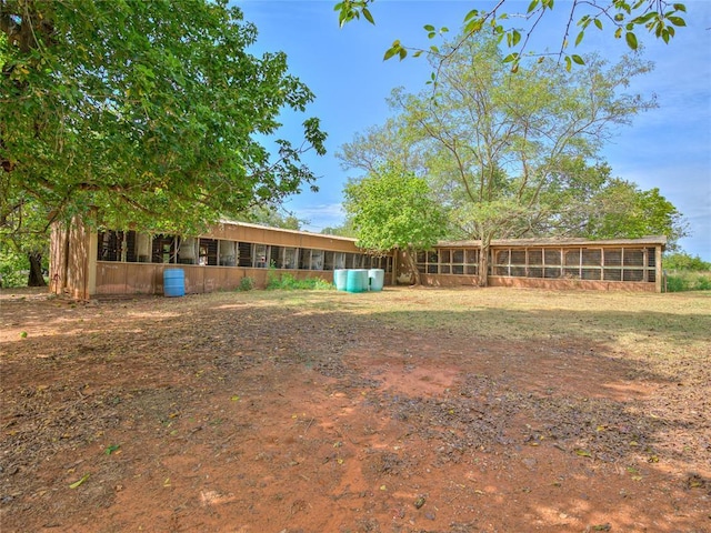 27704 S County Line Ave, Blanchard, OK 73010 - view of yard featuring a sunroom