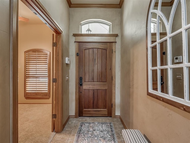 904 Majestic St, Yukon, OK 73099 - carpeted entrance foyer featuring tile patterned floors, baseboards, and ornamental molding
