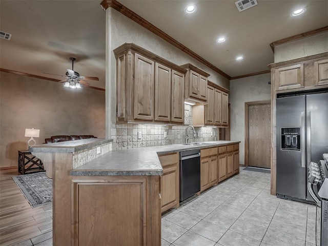 904 Majestic St, Yukon, OK 73099 - kitchen featuring stainless steel appliances, a sink, ornamental molding, a ceiling fan, and decorative backsplash