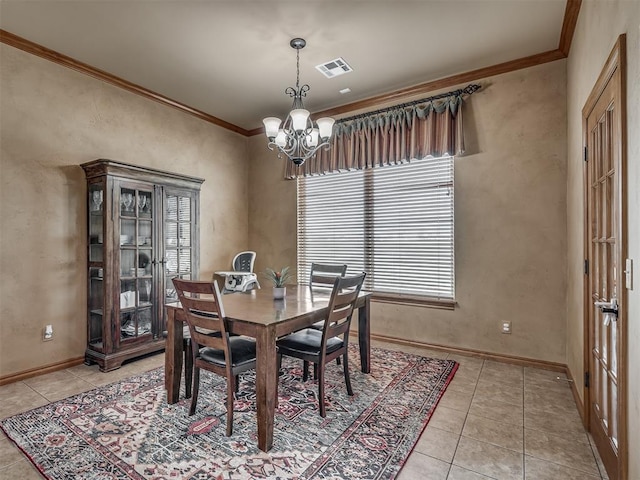 904 Majestic St, Yukon, OK 73099 - dining space featuring a chandelier, crown molding, light tile patterned floors, and baseboards