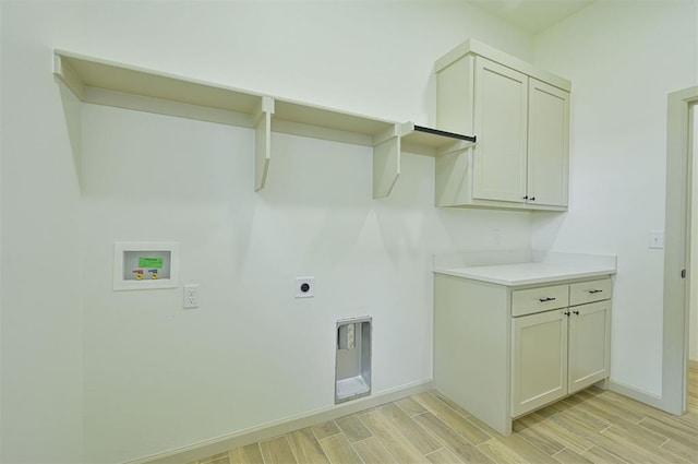 128 E 7th St, Arcadia, OK 73007 - laundry area featuring wood finish floors, hookup for a washing machine, hookup for an electric dryer, and baseboards