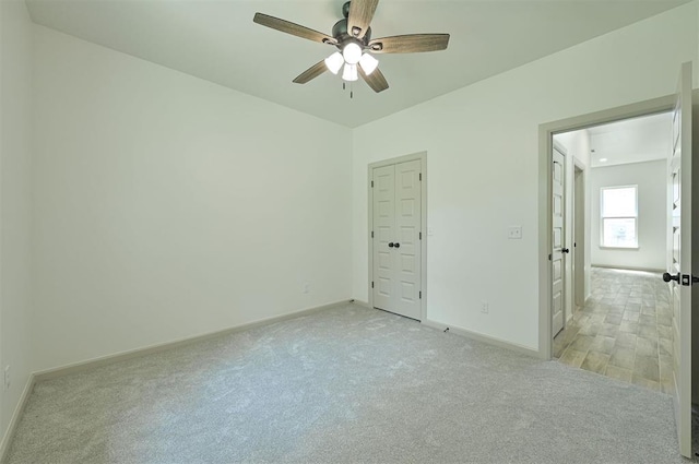 128 E 7th St, Arcadia, OK 73007 - empty room featuring baseboards, light carpet, and ceiling fan