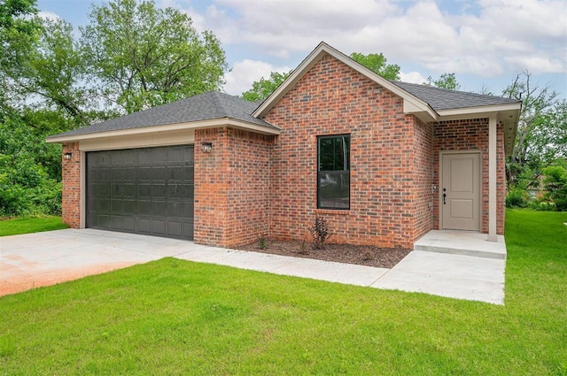 128 E 7th St, Arcadia, OK 73007 - view of front of home featuring an attached garage, a front yard, brick siding, and driveway