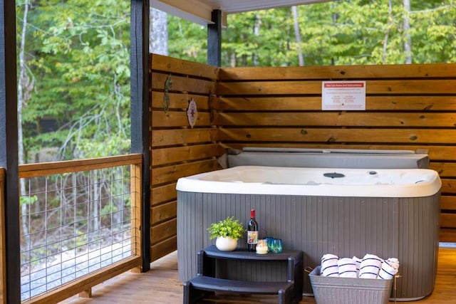 167 Penner Rd, Broken Bow, OK 74728 - wooden deck featuring a hot tub