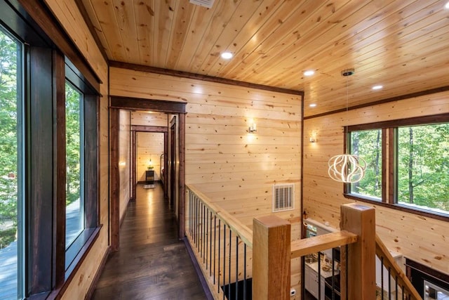 167 Penner Rd, Broken Bow, OK 74728 - hall featuring an upstairs landing, wooden walls, recessed lighting, dark wood finished floors, and wood ceiling