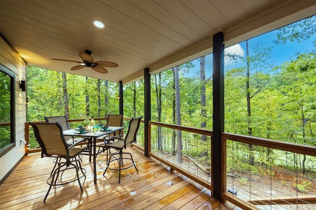 167 Penner Rd, Broken Bow, OK 74728 - sunroom featuring a wooded view, a healthy amount of sunlight, and ceiling fan