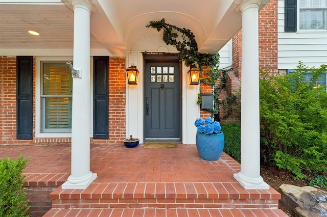 1707 Pennington Way, Nichols Hills, OK 73116 - property entrance featuring covered porch and brick siding