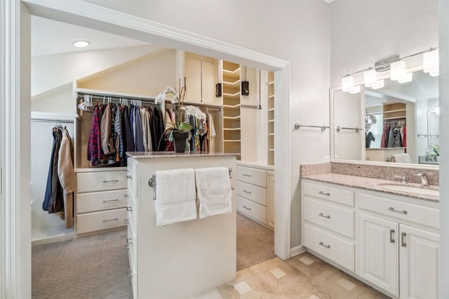 1707 Pennington Way, Nichols Hills, OK 73116 - bathroom featuring vanity and a spacious closet