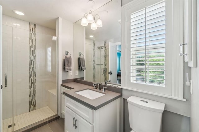 1707 Pennington Way, Nichols Hills, OK 73116 - full bathroom with toilet, a stall shower, vanity, a chandelier, and recessed lighting