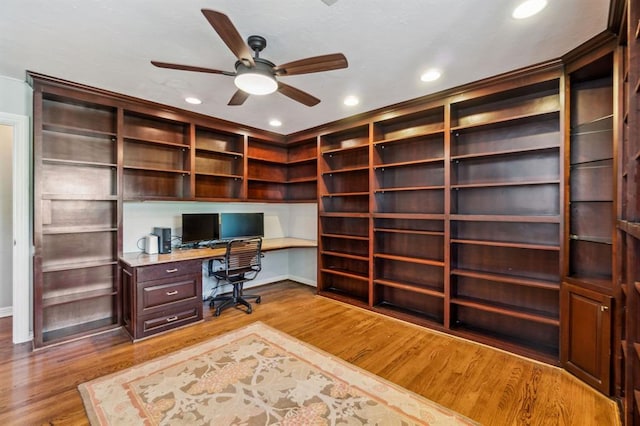 1707 Pennington Way, Nichols Hills, OK 73116 - home office with built in desk, light wood-style floors, ceiling fan, recessed lighting, and baseboards