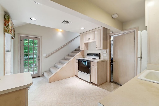1707 Pennington Way, Nichols Hills, OK 73116 - kitchen featuring white electric stove, light countertops, a sink, recessed lighting, and light brown cabinets