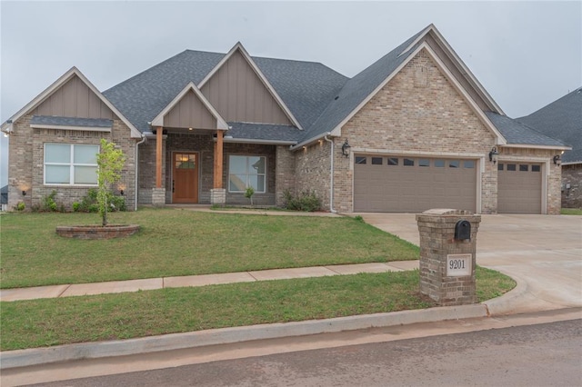craftsman-style house featuring driveway, an attached garage, a front lawn, and board and batten siding