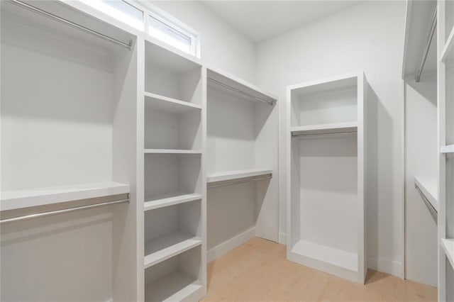 walk in closet featuring light wood-type flooring