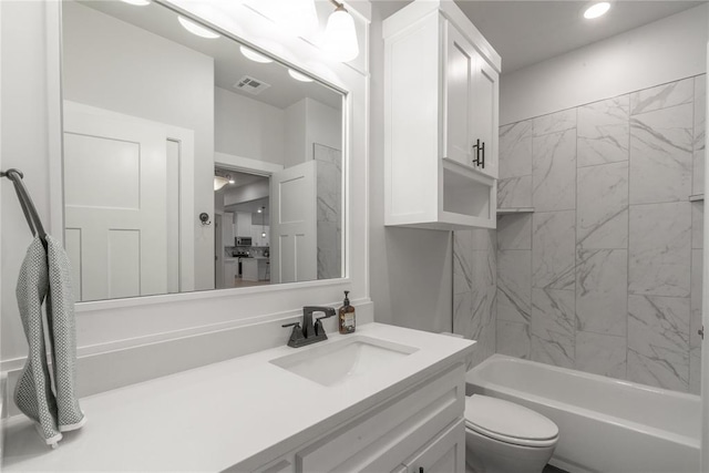 bathroom with vanity, recessed lighting, toilet, visible vents, and  shower combination